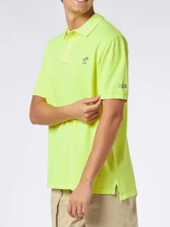 Herren-Poloshirt aus fluogelbem Piquet mit St. Barth-Logo und Vintage-Effekt