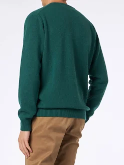 Herrenpullover mit Rundhalsausschnitt und Jacquard-Print „Courma vs. St. Moritz“.