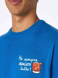 Herren-Skipullover Heron in Blau mit Stickerei „Ho sempre sbagliato tutto“.